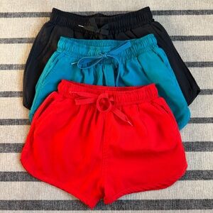 KJ Mini Retro Shorties Swim Shorts - Lava Red, Ocean Depths (Teal), Black